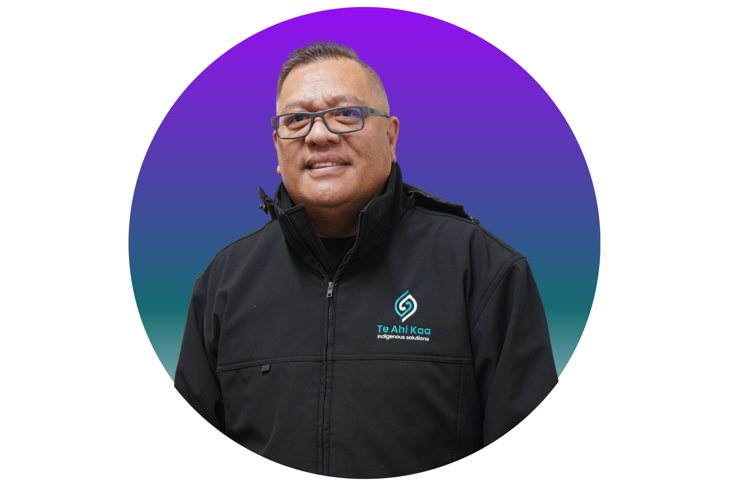 Warren is a middle aged man wearing glasses and a black Te Ahi Kaa jacket.