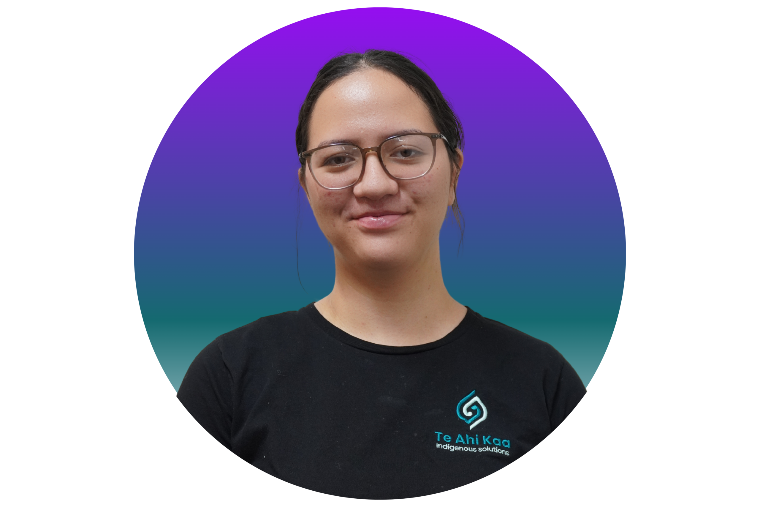 Myan is a young woman wearing eye glasses; she is wearing a black shirt with a Te Ahi Kaa logo.